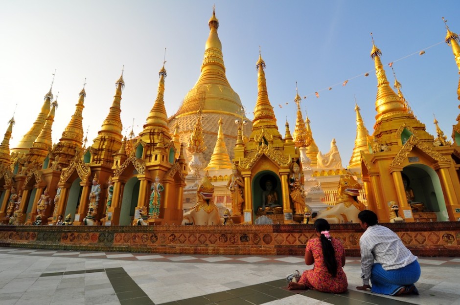 Praying couple at Shwedagon Pagoda in Yangon.